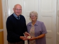 John Wilkinson, AIPF, receiving the Brendan Walkin medal from Lilian Webb, AIPF