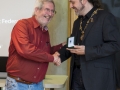 IPF President Michael O'Sullivanpresenting judge Jacky Martin with medal.jpg