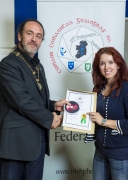 IPF President Michael O'Sullivan presenting LIPF distinction to Sigita Playdon.jpg