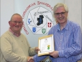 IPF Distinctions Chairman pictured presenting LIPF distinction to Jim Kelly