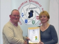 IPF Distinctions Chairman pictured presenting LIPF distinction to Julie Watson