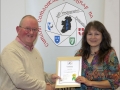 IPF Distinctions Chairman pictured presenting LIPF distinction to Lorraine Strang