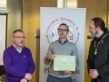 IPF President Michael O'Sullivan & IPF FIAP Liaison Officer Paul Stanley presenting AFIAP distinction to Marek Biegalski.jpg