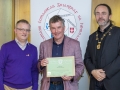 IPF President Michael O'Sullivan & IPF FIAP Liaison Officer Paul Stanley presenting EFIAP/platinum distinction to Tony McDonnell