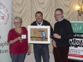 Kieran White from Whites Photo Centre Kilkenny and IPF Vice-President Lilian Webb pictured with award winner Mario Mac Rory.jpg Kieran White from Whites Photo Centre Kilkenny and IPF Vice-President Lilian Webb pictured with award winner Mario Mac Rory.jpg