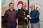 Shane Cowley from Canon Ireland and judge Rikki O'Neill presenting his judge's award medal to Michael O'Sullivan